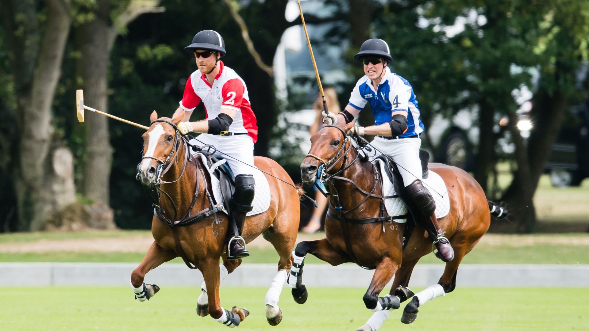 Prince William, Duke of Cambridge and Prince Harry, Duke of Sussex play during The King Power Royal Charity Polo Day