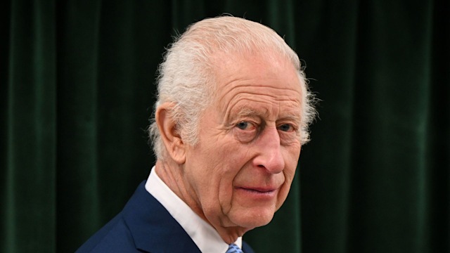 Britain's King Charles III reacts as he visits the Coronation Food Project hub, located at the Deptford Trading Estate, in southeastern London, on November 14, 2024, during the centre inauguration