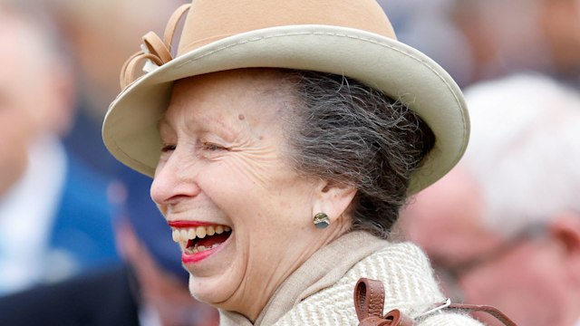 princess anne smiling in herringbone coat 