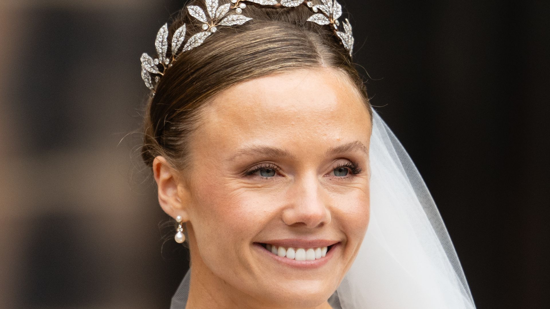 Olivia Grosvenor shoulders up in wedding dress and tiara