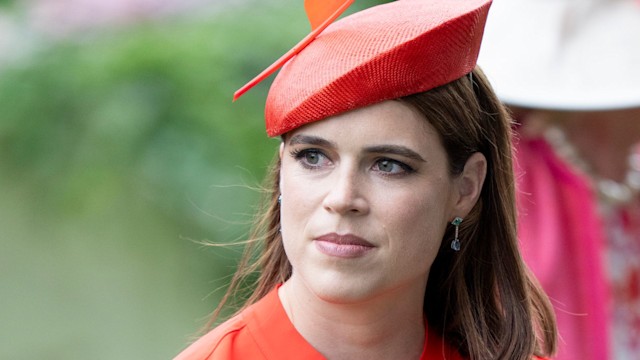 Princess Eugenie wearing red hat and dress at Royal Ascot
