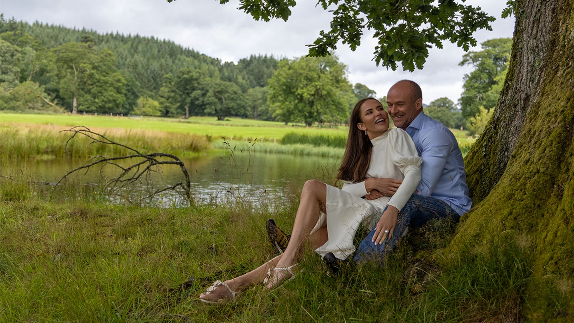 Sophie Anderton sits under a tree with her husband Kaz