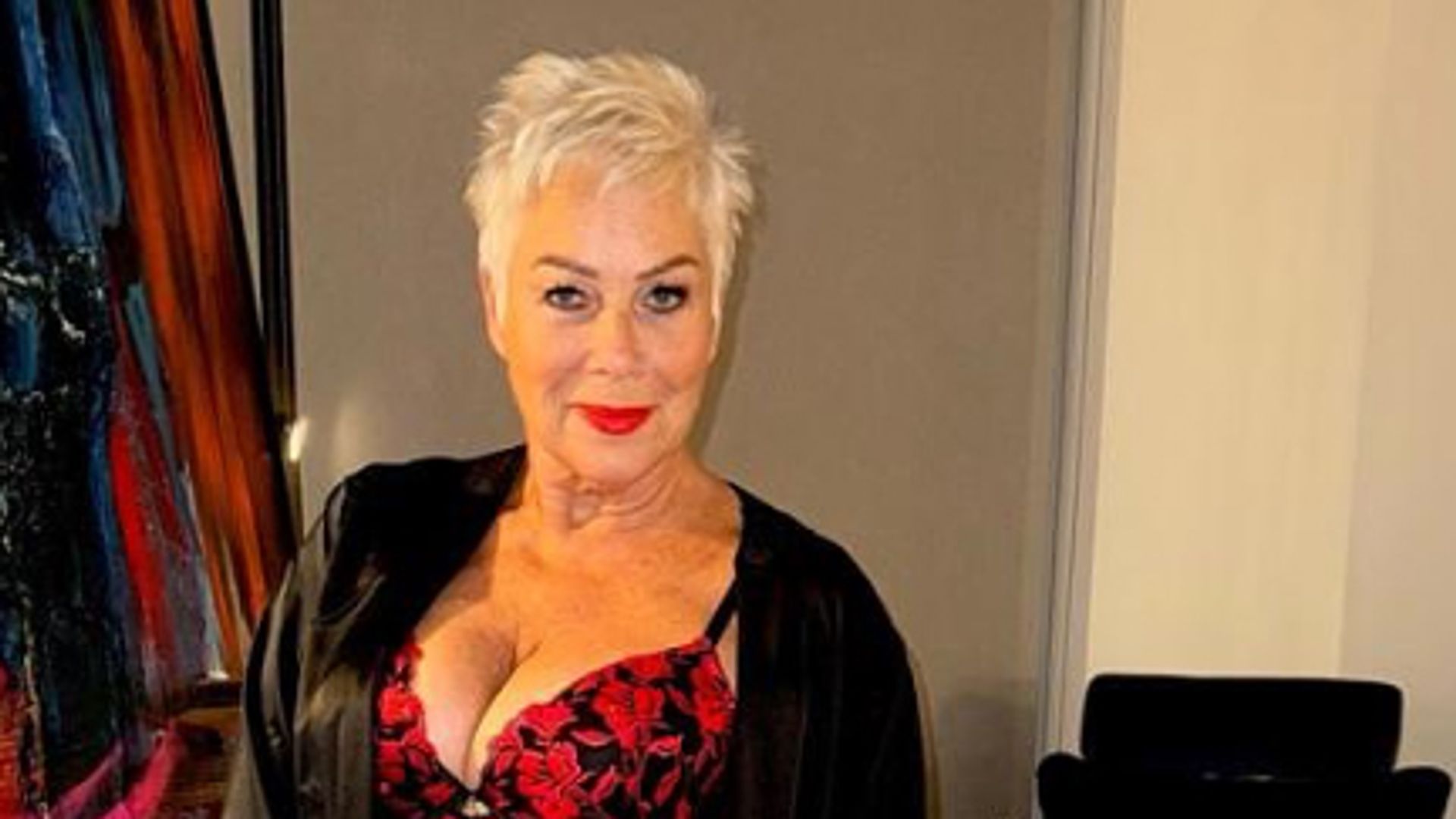 Denise Welch in a floral corset, negligee and pair of tights