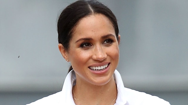 meghan markle smiling in white shirt