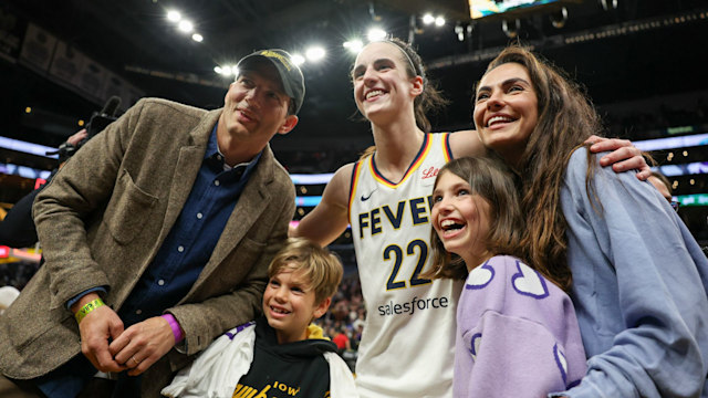 Caitlin Clark of the Indiana Fever poses for pictures with Ashton Kutcher, Mila Kunis and their kids after defeating the Los Angeles Sparks 78-73 to win a WNBA basketball game at Crypto.com Arena in Los Angeles on Friday, May 24, 2024