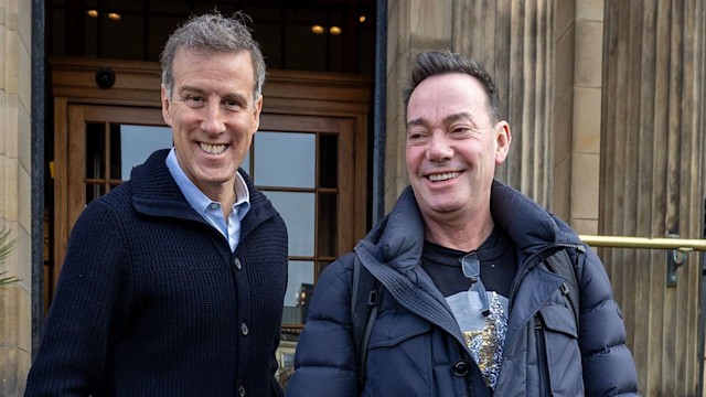 Anton Du Beke and Craig Revel Horwood standing outside of a hotel