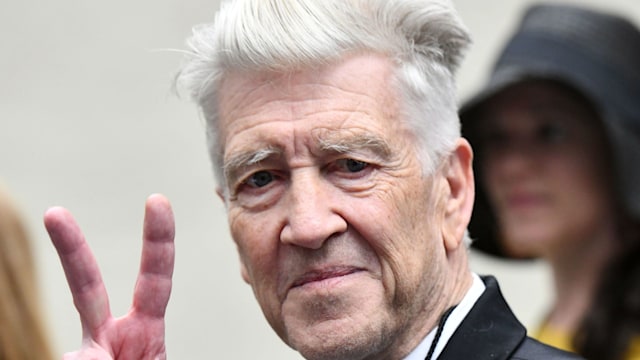 David Lynch giving a peace sign