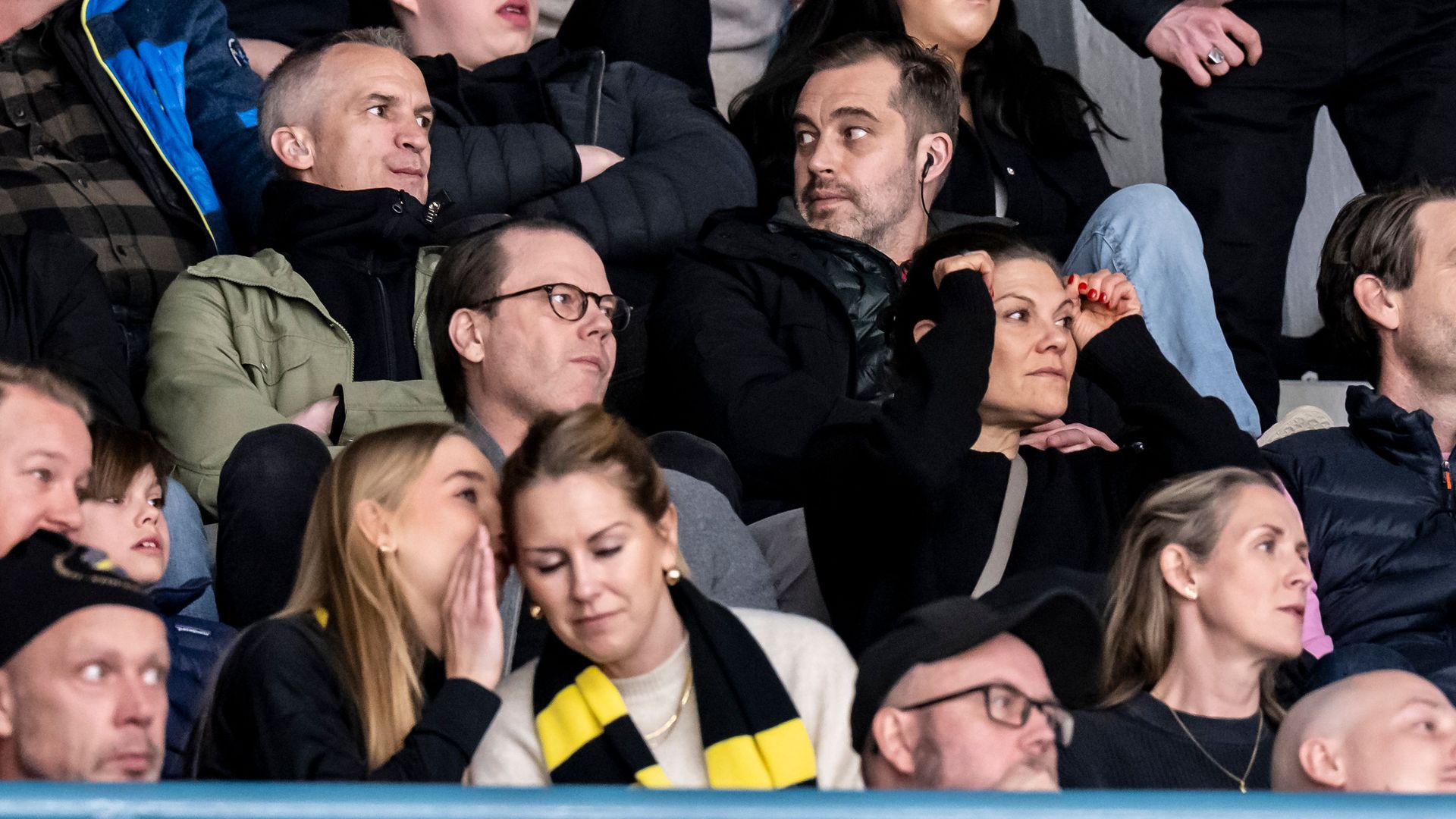 Prince Daniel sitting next to a concerned Crown Princess Victoria