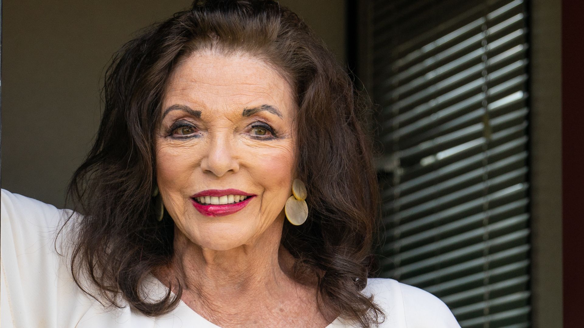 Dame Joan Collins poses for photographers at Kite Festival 2023 