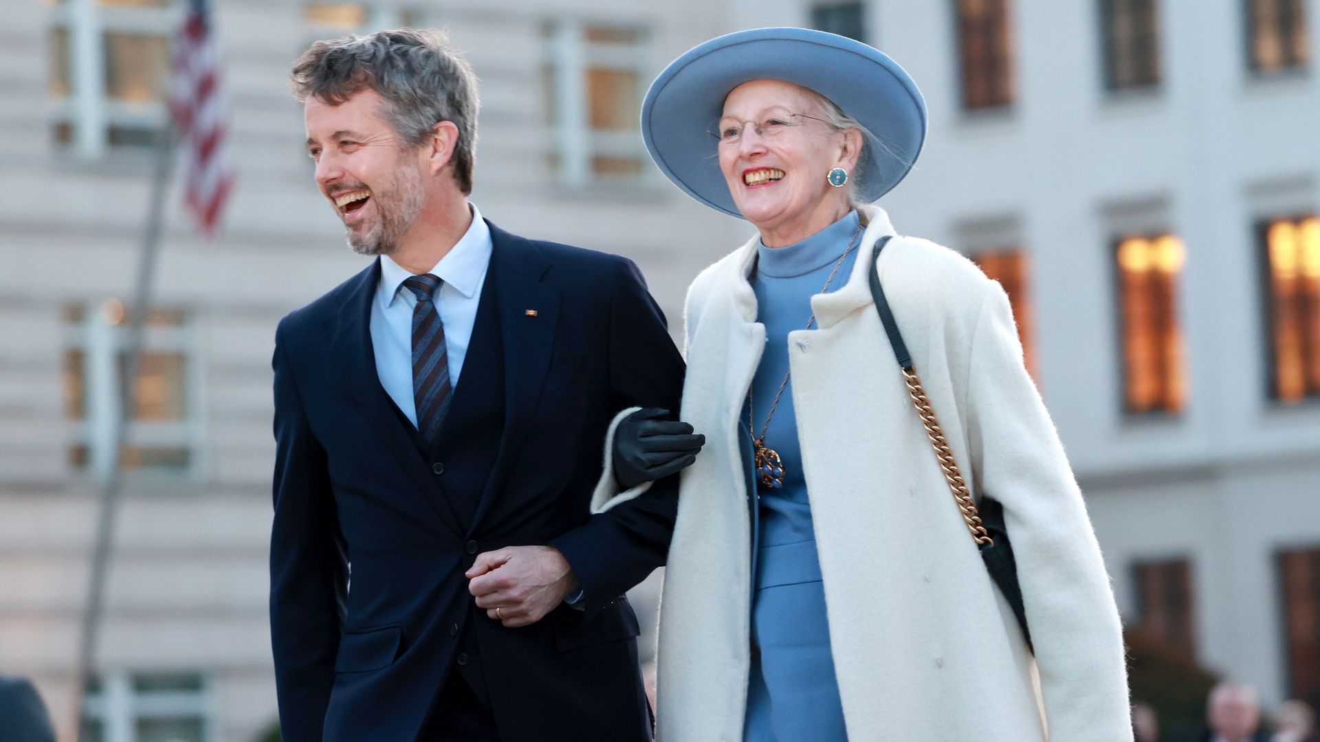 Frederik walking arm in arm with Queen Margrethe