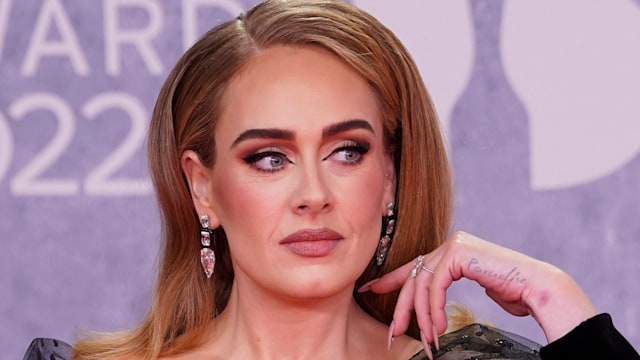 Adele Laurie Blue Adkins aka Adele poses on the red carpet upon her arrival for the BRIT Awards 2022 