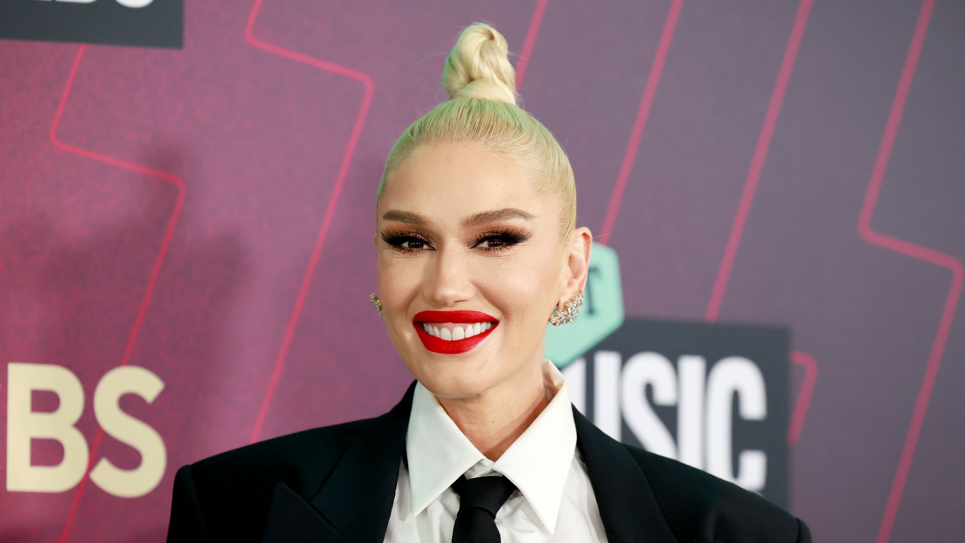 Gwen Stefani in suit and red lip