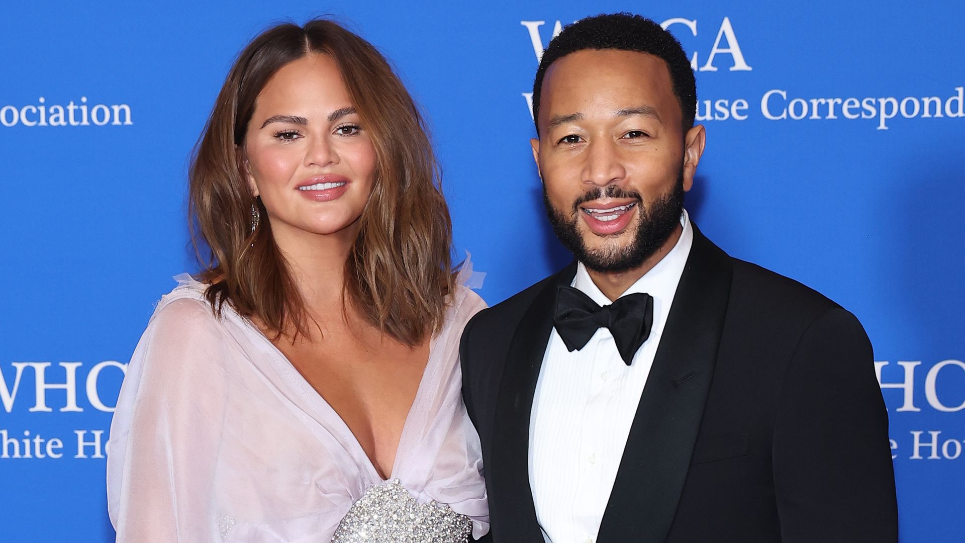 Chrissy Teigen looks sensational in thighsplit gown with husband John(02)
