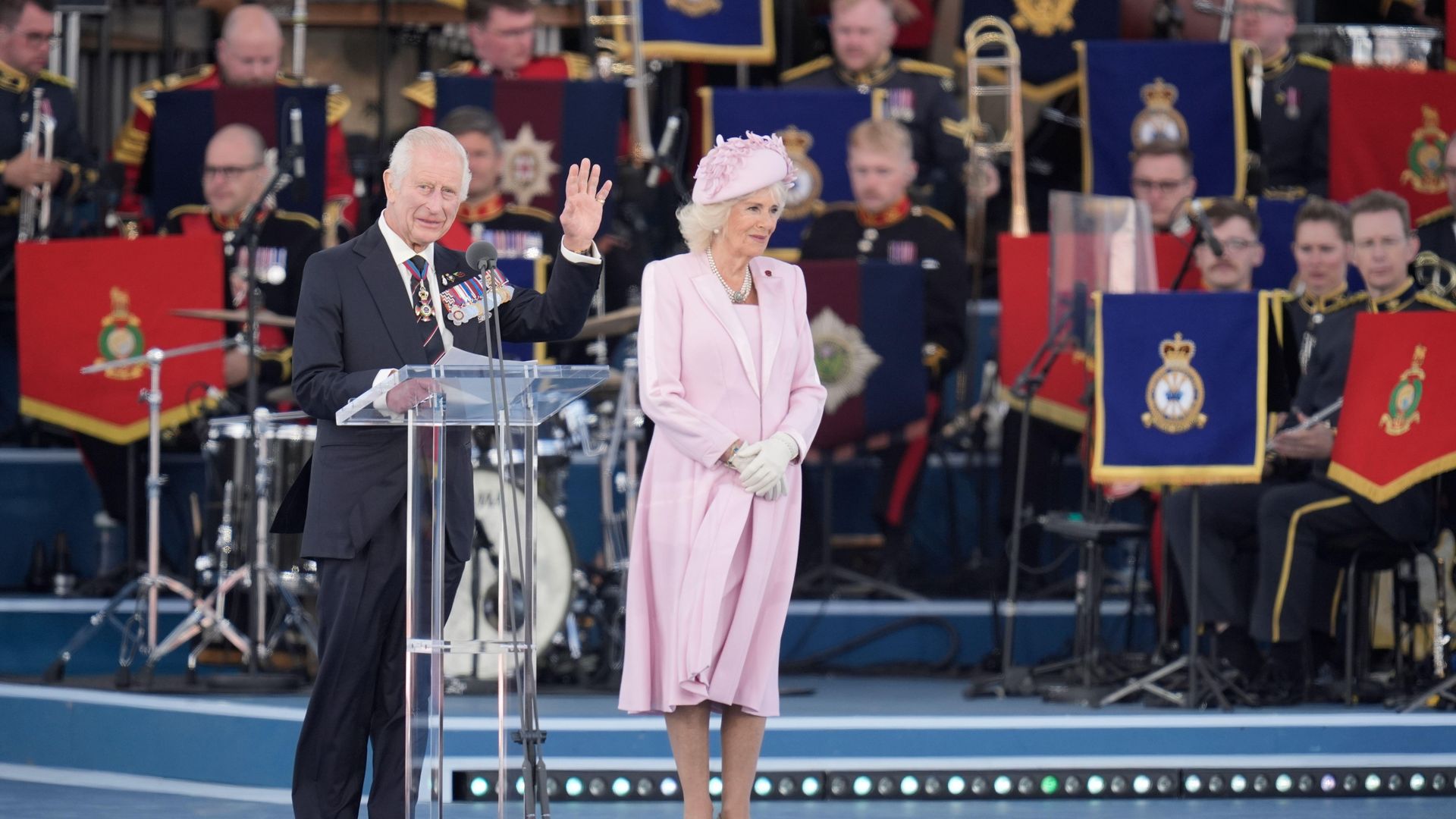 king charles and queen camilla on stage 