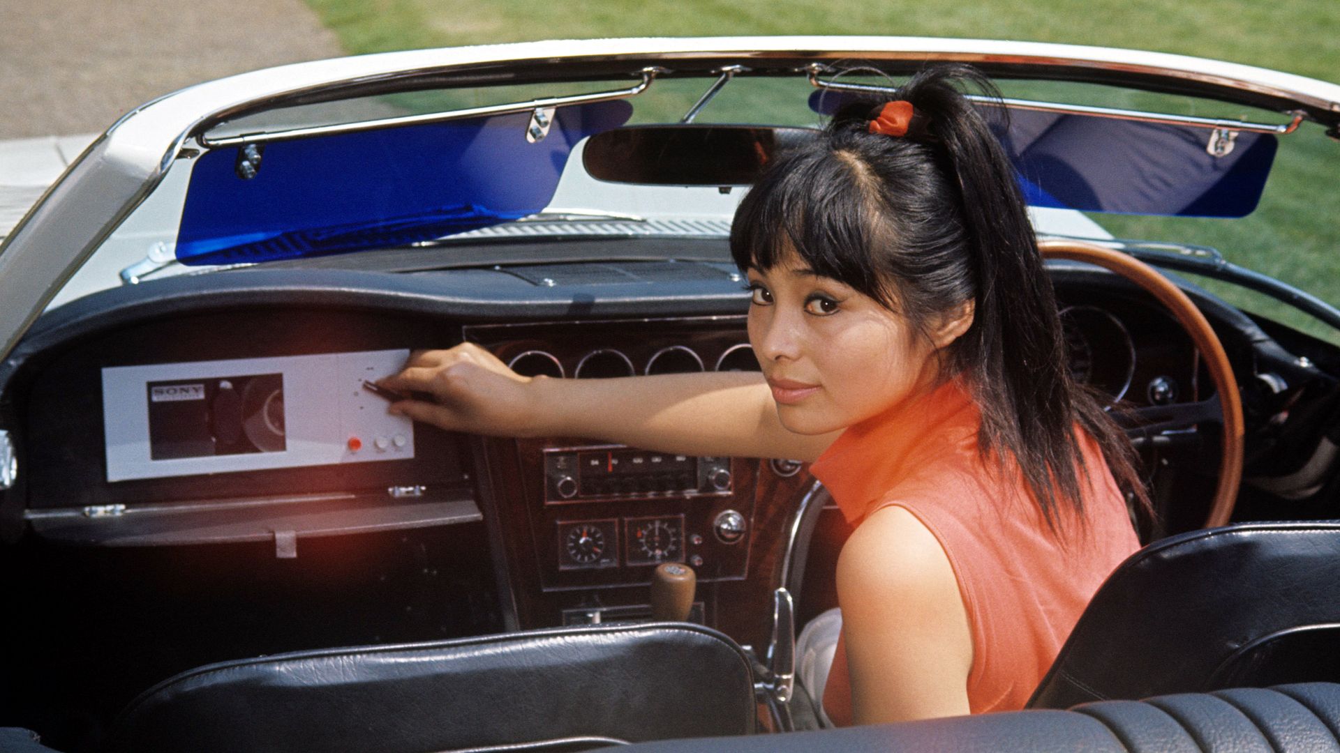 Akiko Wakabayashi as Aki behind the wheel of a car in You Only Live Twice