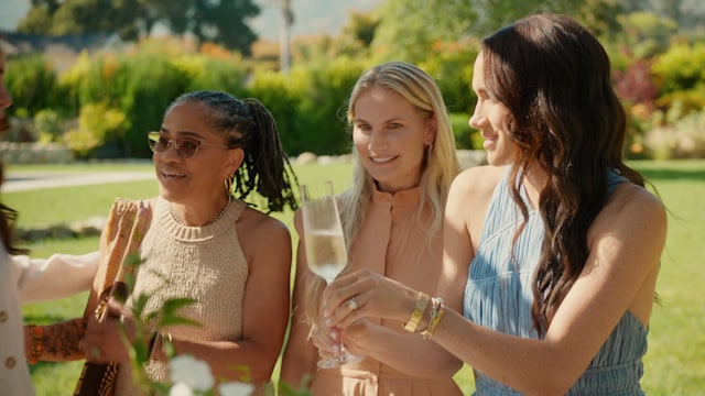 Doria Ragland enjoys a glass of Champagne with her daughter Meghan Markle