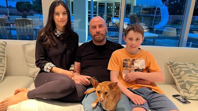 John Travolta with his children Ella and Ben - with their pool in the background