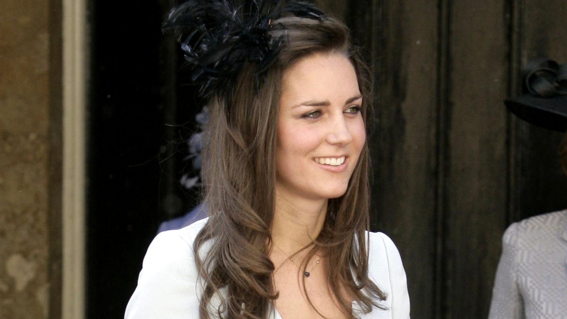 Kate Middleton in a blue dress and white jacket at Lady Rose Windsor's wedding