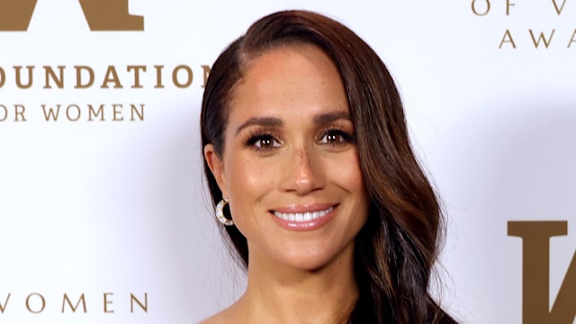 Meghan Markle in gold shoulderless dress