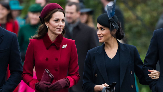 Princess Kate and Meghan Markle walking in formal attire