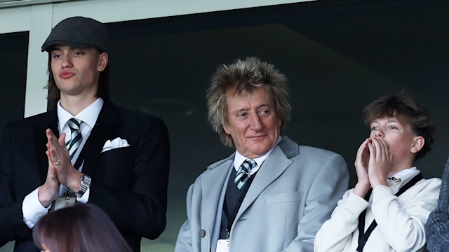 Alastair Stewart, Rod Stewart and Aiden Stewart watching a football match