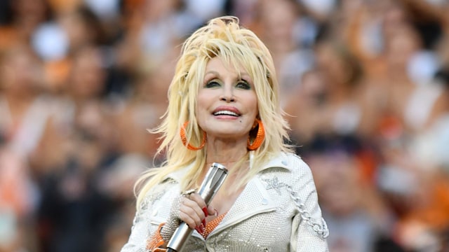 KNOXVILLE, TN - NOVEMBER 18: Dolly Parton performs during the college football game between the Georgia Bulldogs and the Tennessee Volunteers on November 18, 2023, at Neyland Stadium in Knoxville, TN. (Photo by Jeffrey Vest/Icon Sportswire via Getty Images)