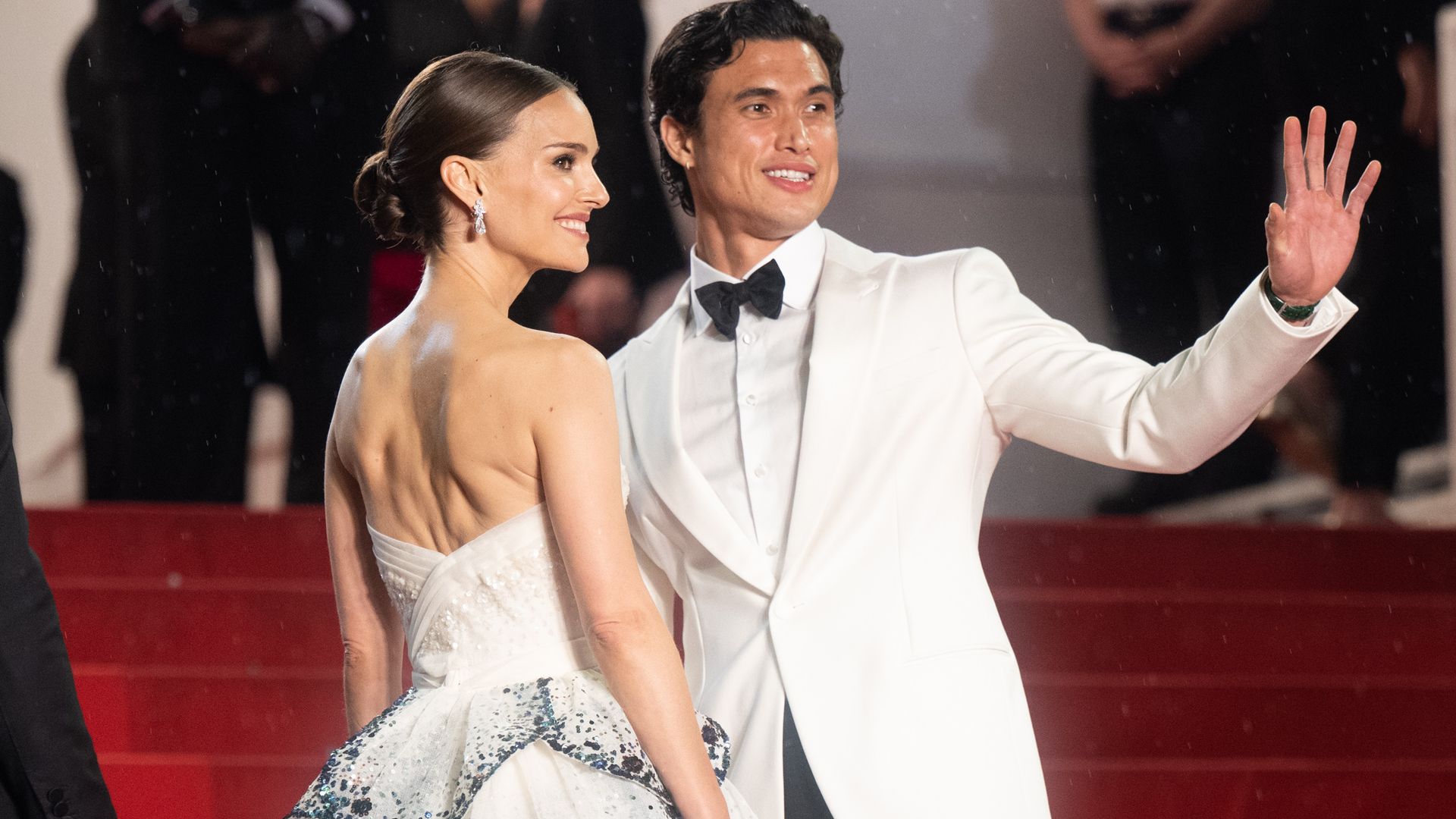 Natalie Portman and her co-star Charles Melton attend the May December red carpet screening at the Cannes Film Festival 