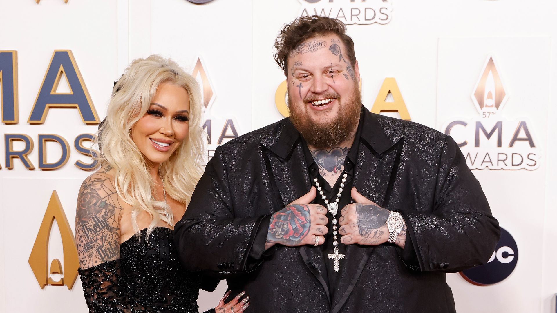 photo of jelly roll and wife bunnie xo both wearing black at cma awards