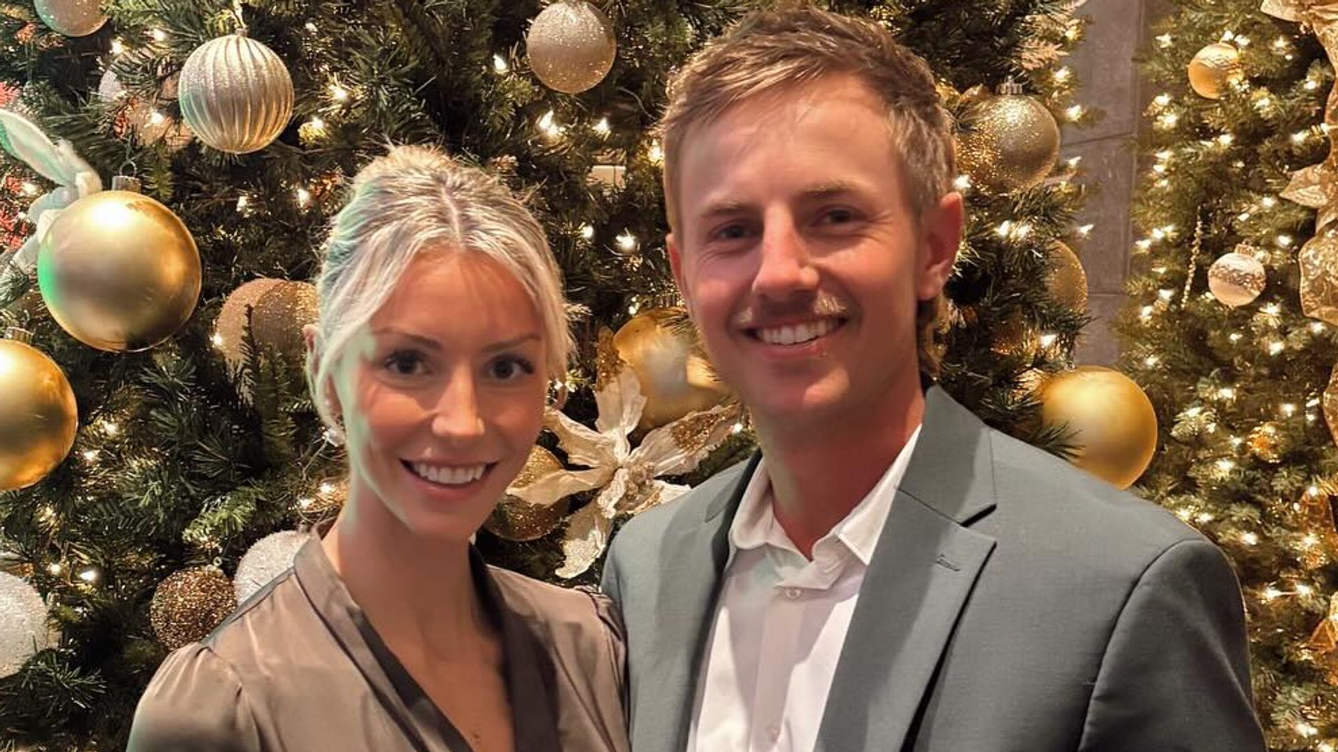 photo of jake knapp and girlfriend makena white in front of christmas tree