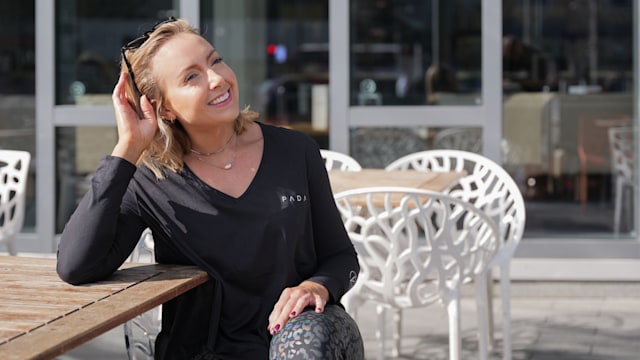 Woman smiling in sunglasses