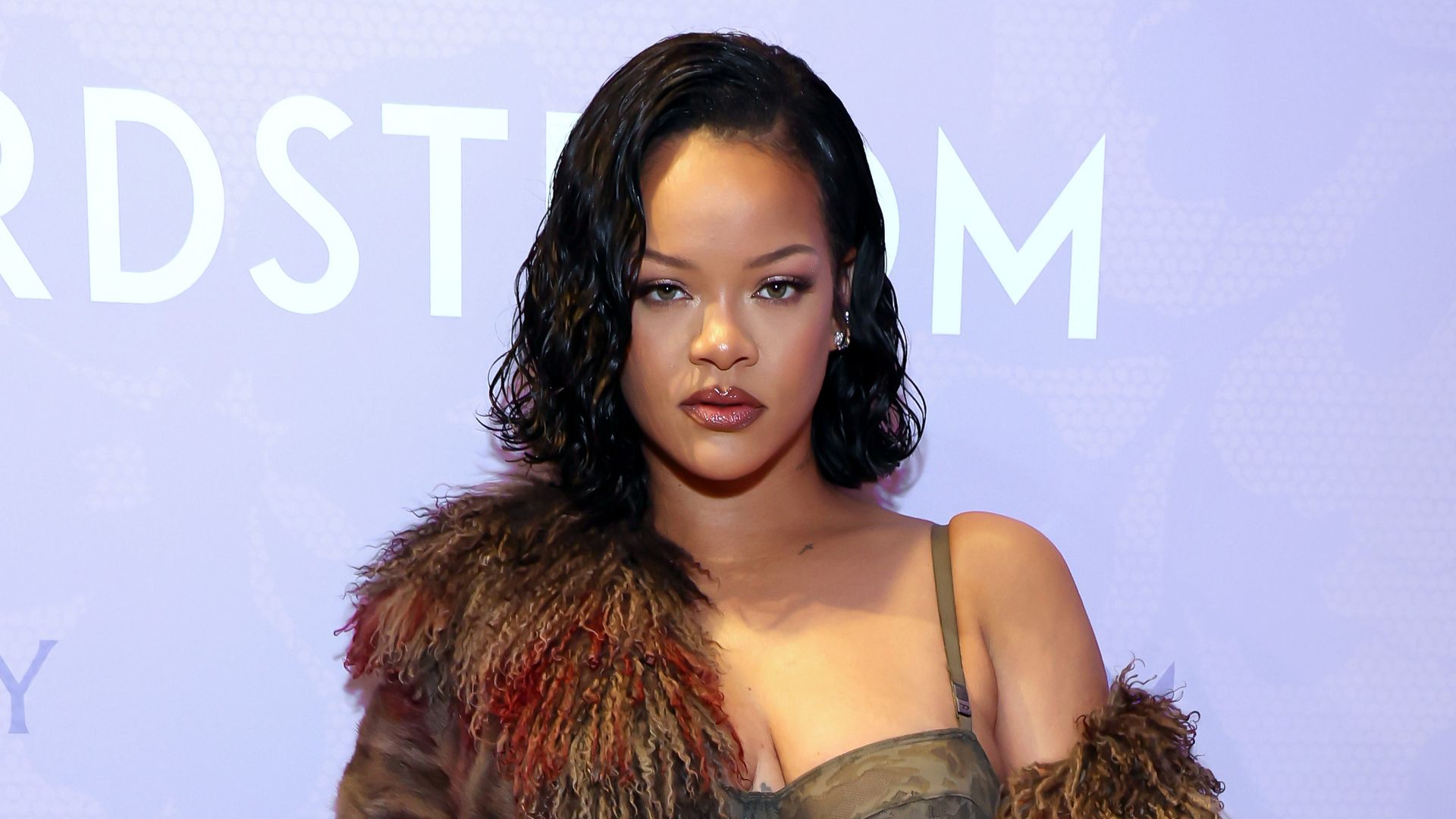 Rihanna highlights her curves in lacy lingerie in head-turning new appearance