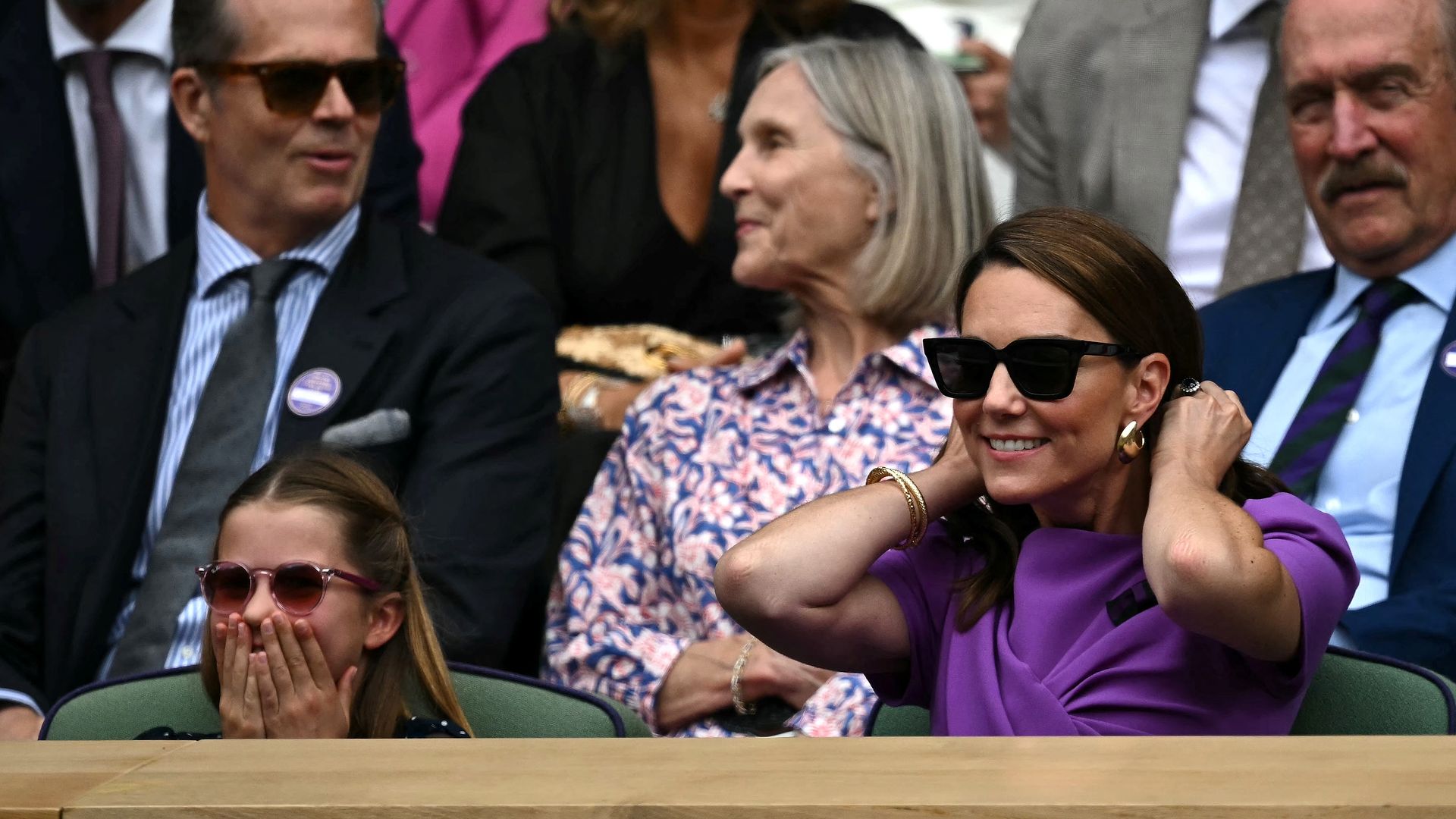 kate and charlotte looking surprised at wimbledon