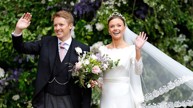 Duke and Duchess of Westminster waving in their wedding outfits