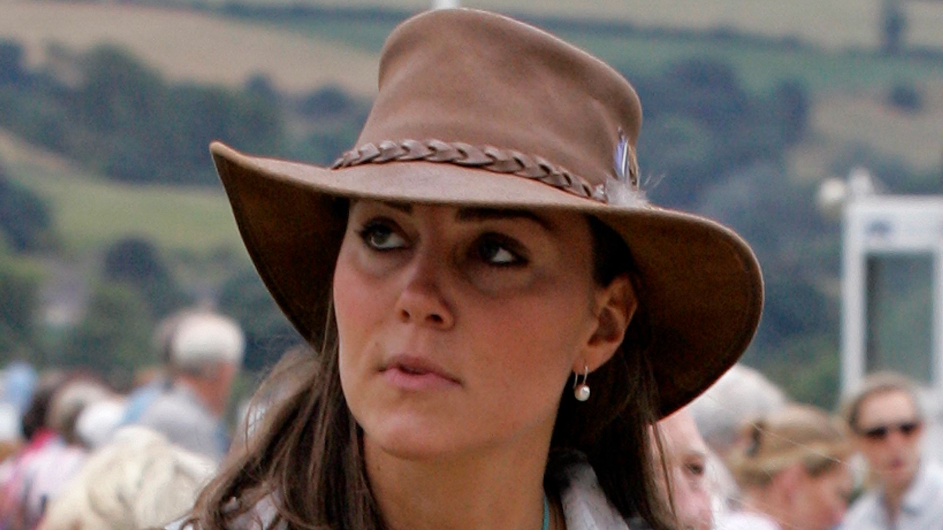 Kate Middleton wearing brown hat and pearl earrings at Festival of British Eventing at Gatcombe Park in 2005 