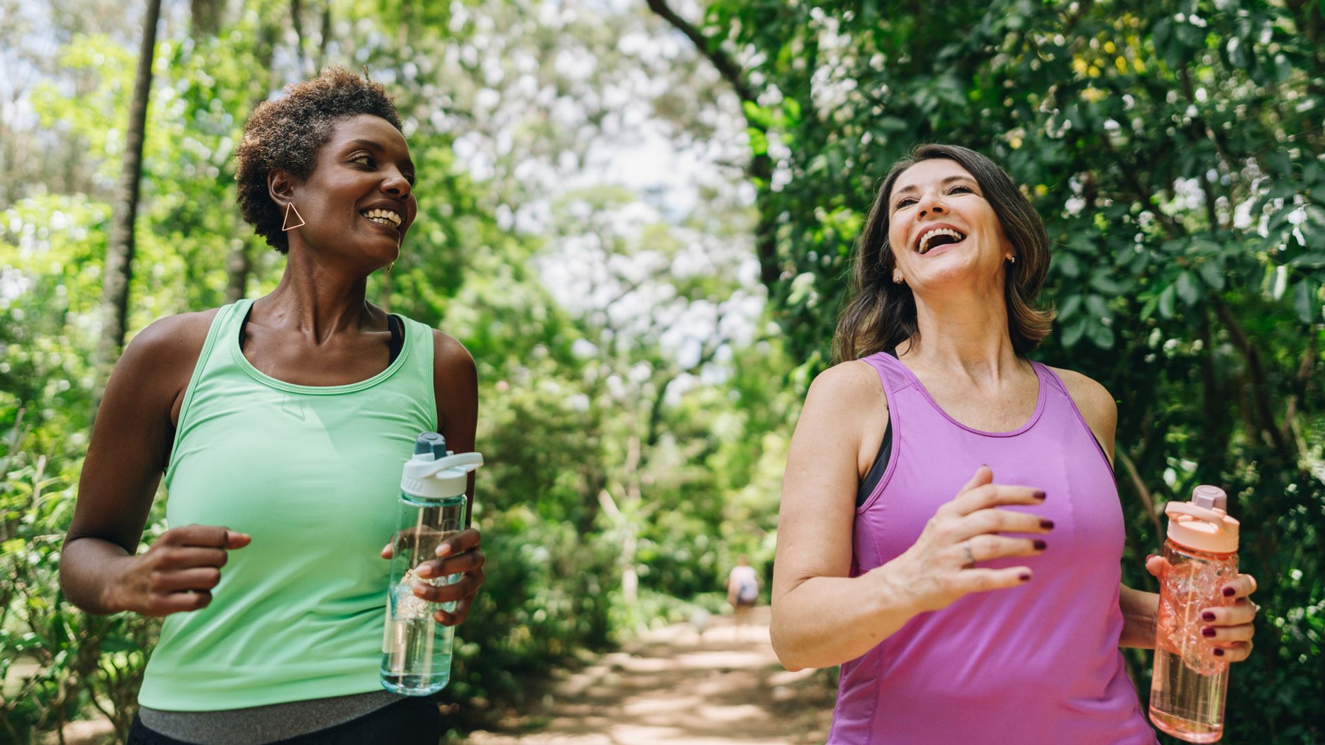 two women running in park