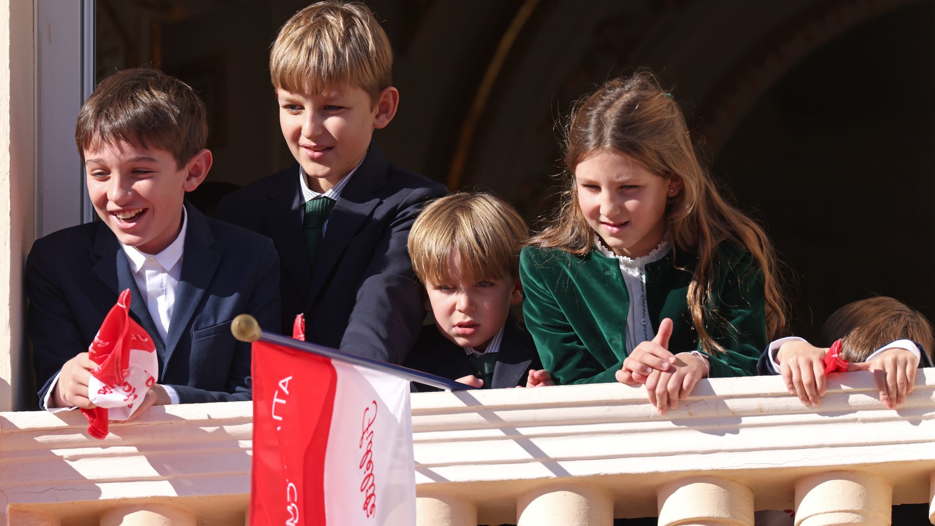 monaco royal kids with flags on balcony