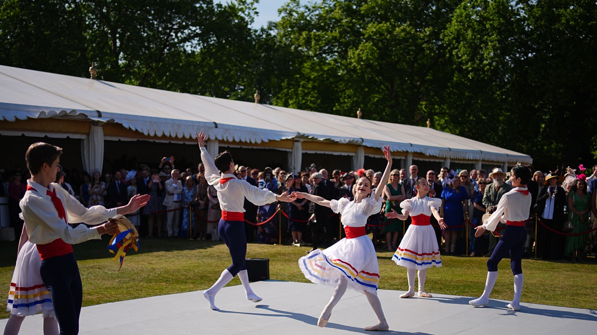 Ballet dancers performing at a garden party
