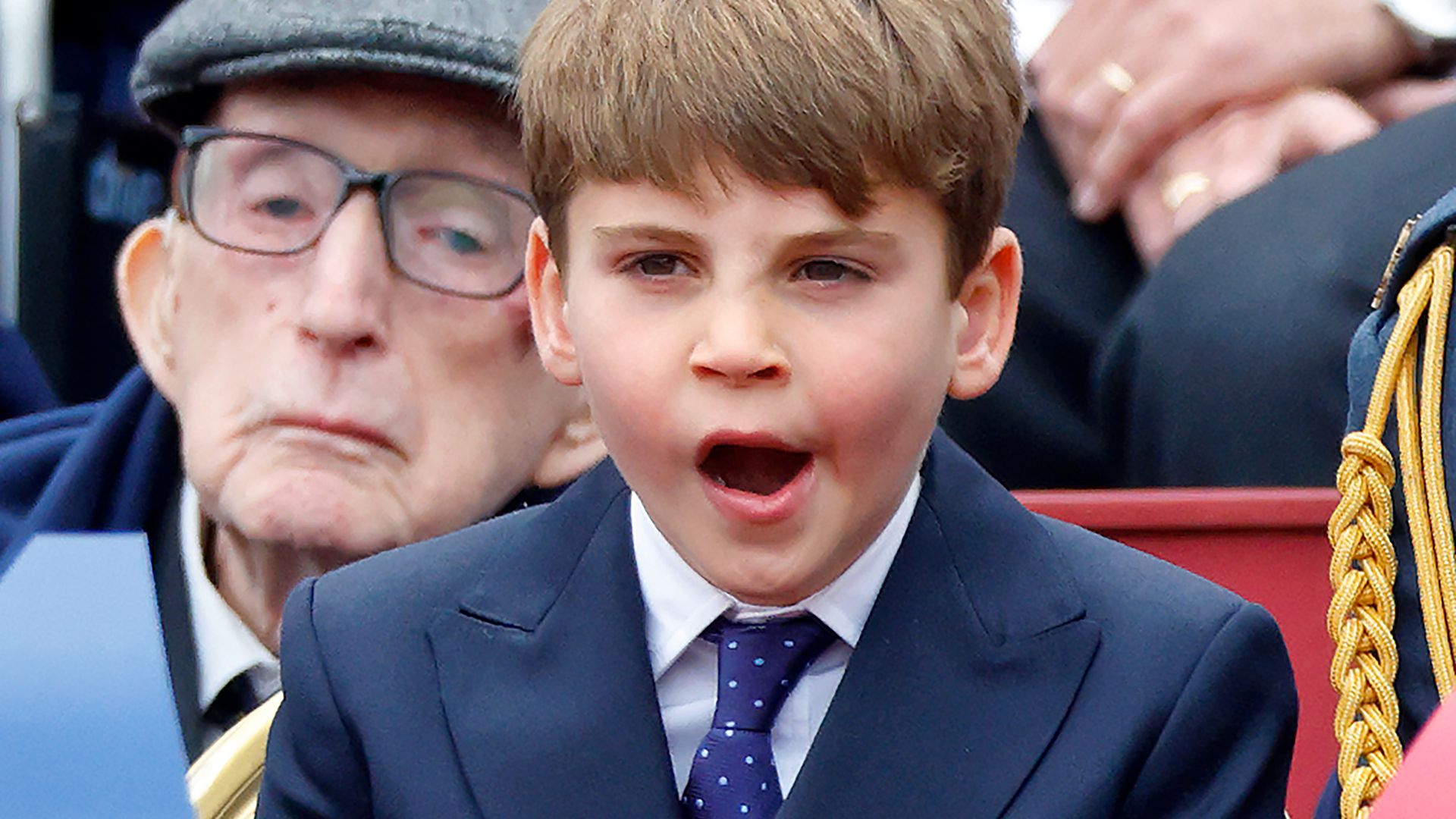 Prince Louis of Wales yawns during the military procession, down The Mall, to mark the 80th anniversary of VE Day on May 5, 2025 in London, England.