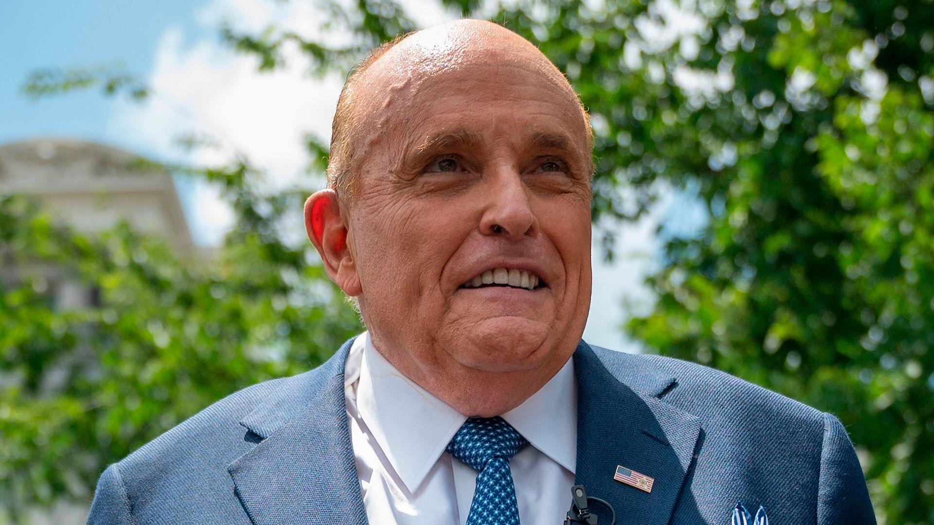 rudy giuliani blue suit speaking