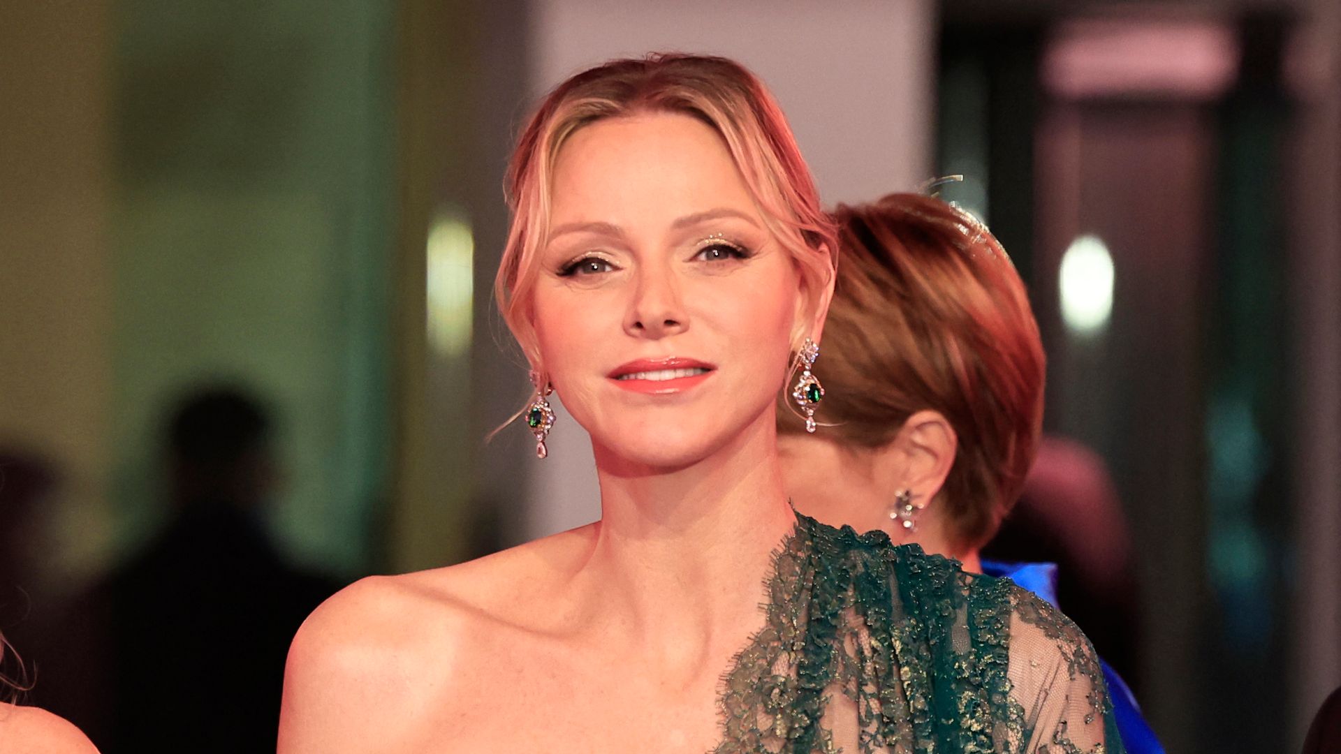 Princess Charlene looks elegant as ever in an emerald dress by Dolce & Gabbana