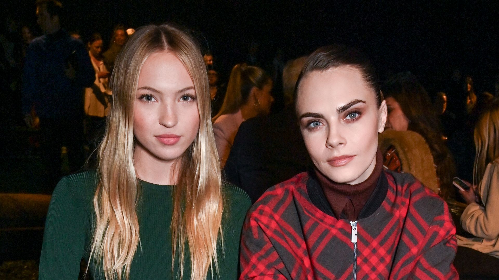 LONDON, ENGLAND - FEBRUARY 19: Lila Moss and Cara Delevingne attend the Burberry Winter 2024 show during London Fashion Week on February 19, 2024 in London, England. (Photo by Dave Benett/Getty Images for Burberry)