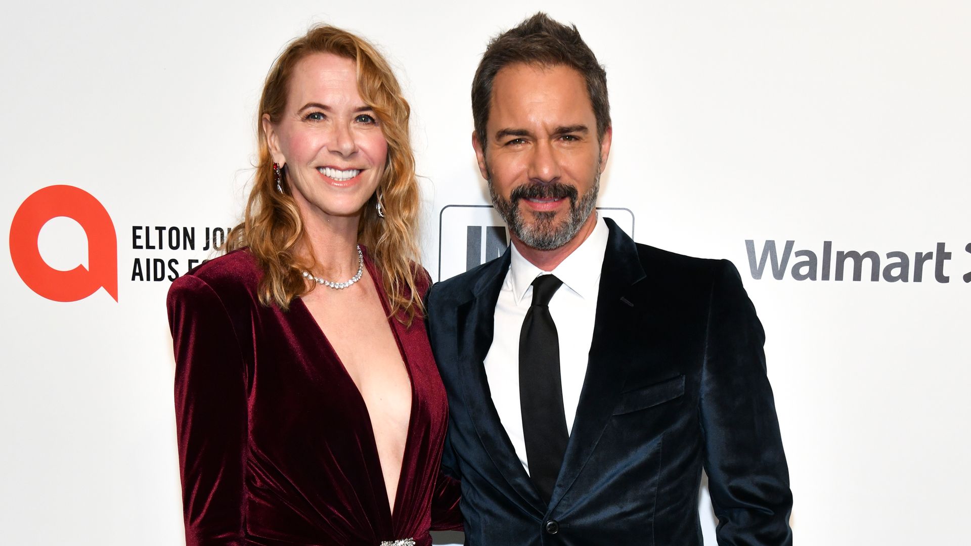 Janet Holden standing with Eric McCormack