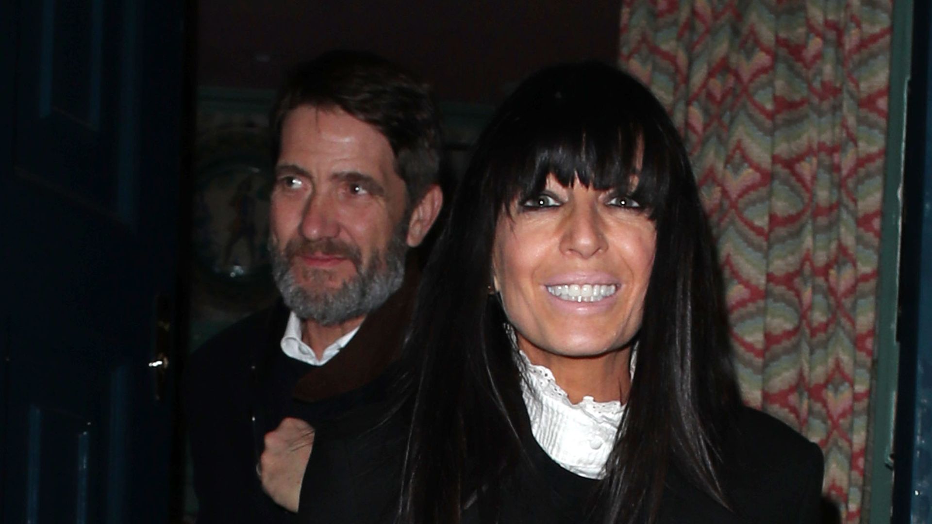 Claudia Winkleman oozes chic in black blazer and killer boots during rare date night with husband