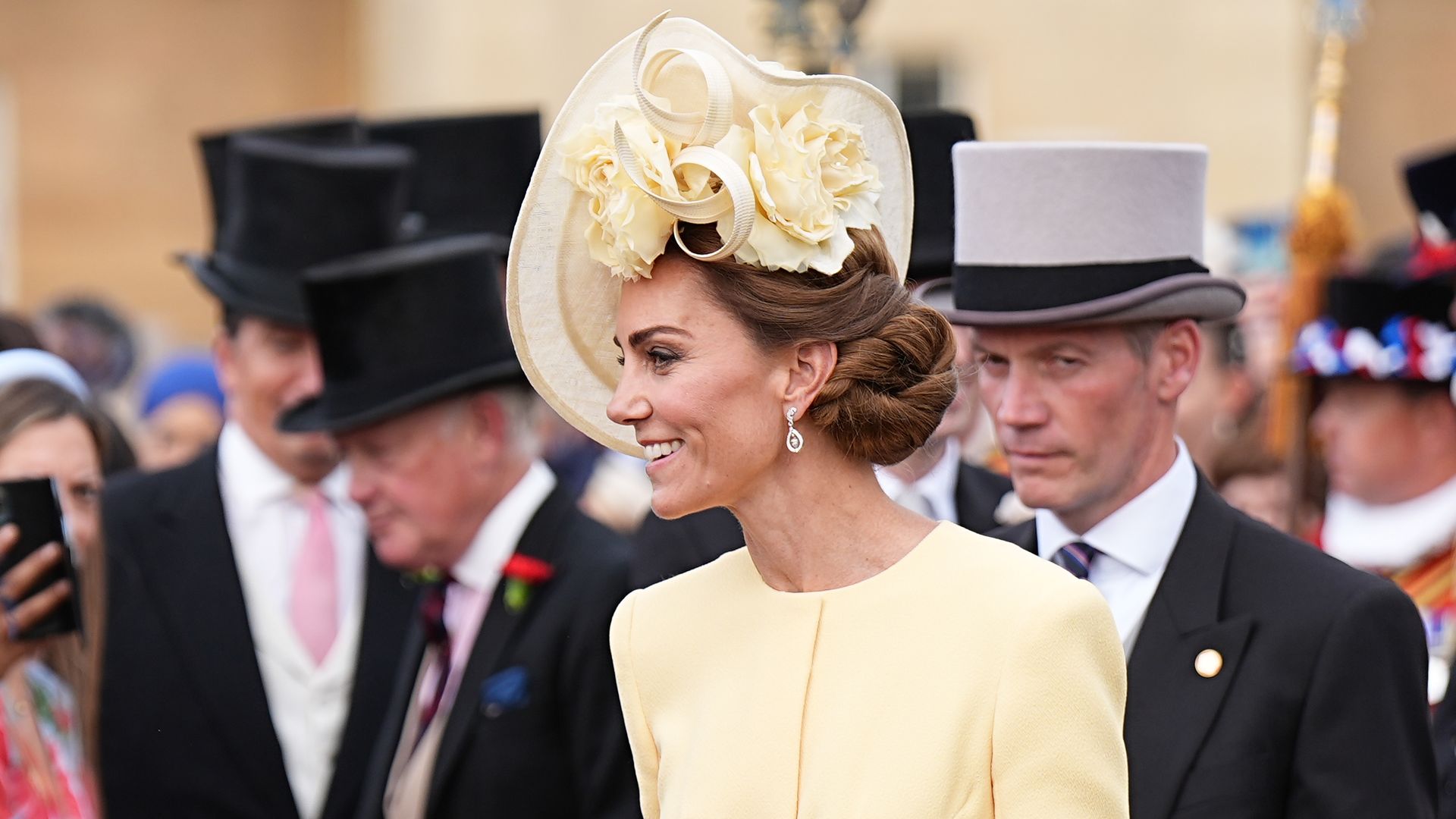Kate Middleton greets guests during a Royal Garden Party