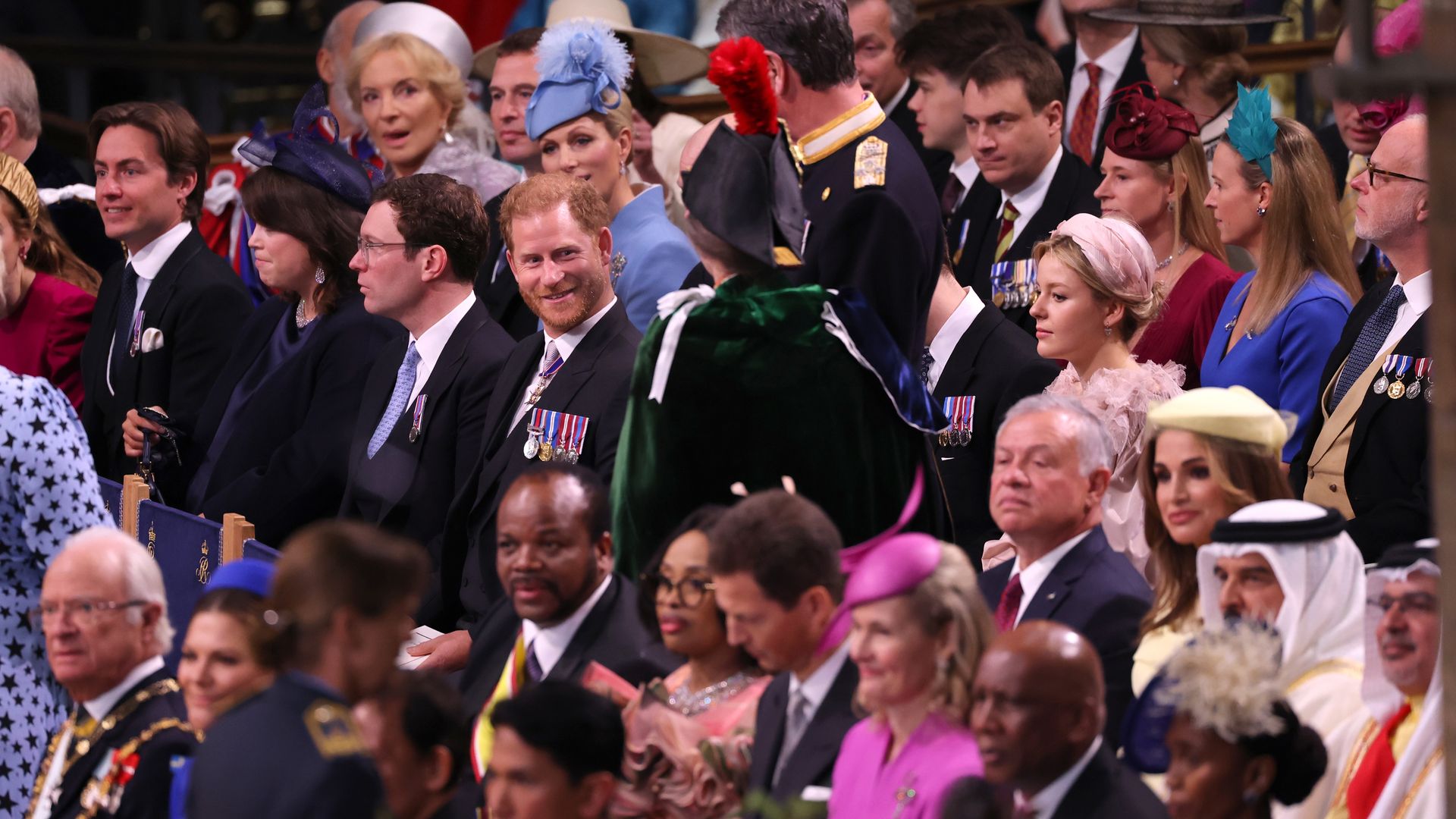 Prince Harry smiling at Princess Anne in Westminster Abbey