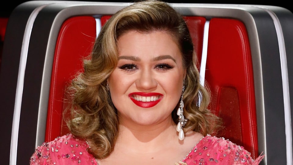 The Voice's Kelly Clarkson feels the heat in dramatic plunging sheer gown |  HELLO!