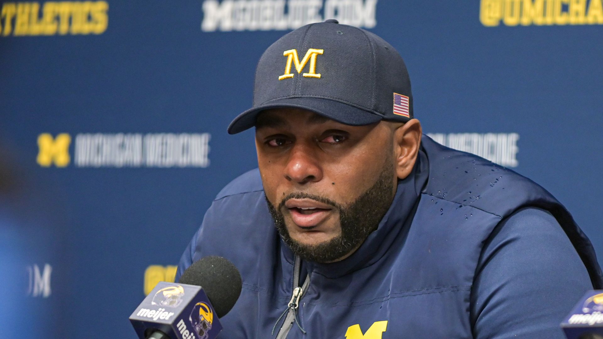 Head Football Coach Sherrone Moore of the Michigan Wolverines speaks to media during the post game press conference after a college football game against the Ohio State Buckeyes at Michigan Stadium on November 29, 2025 in Ann Arbor, Michigan. The Ohio State Buckeyes won the game 27-9