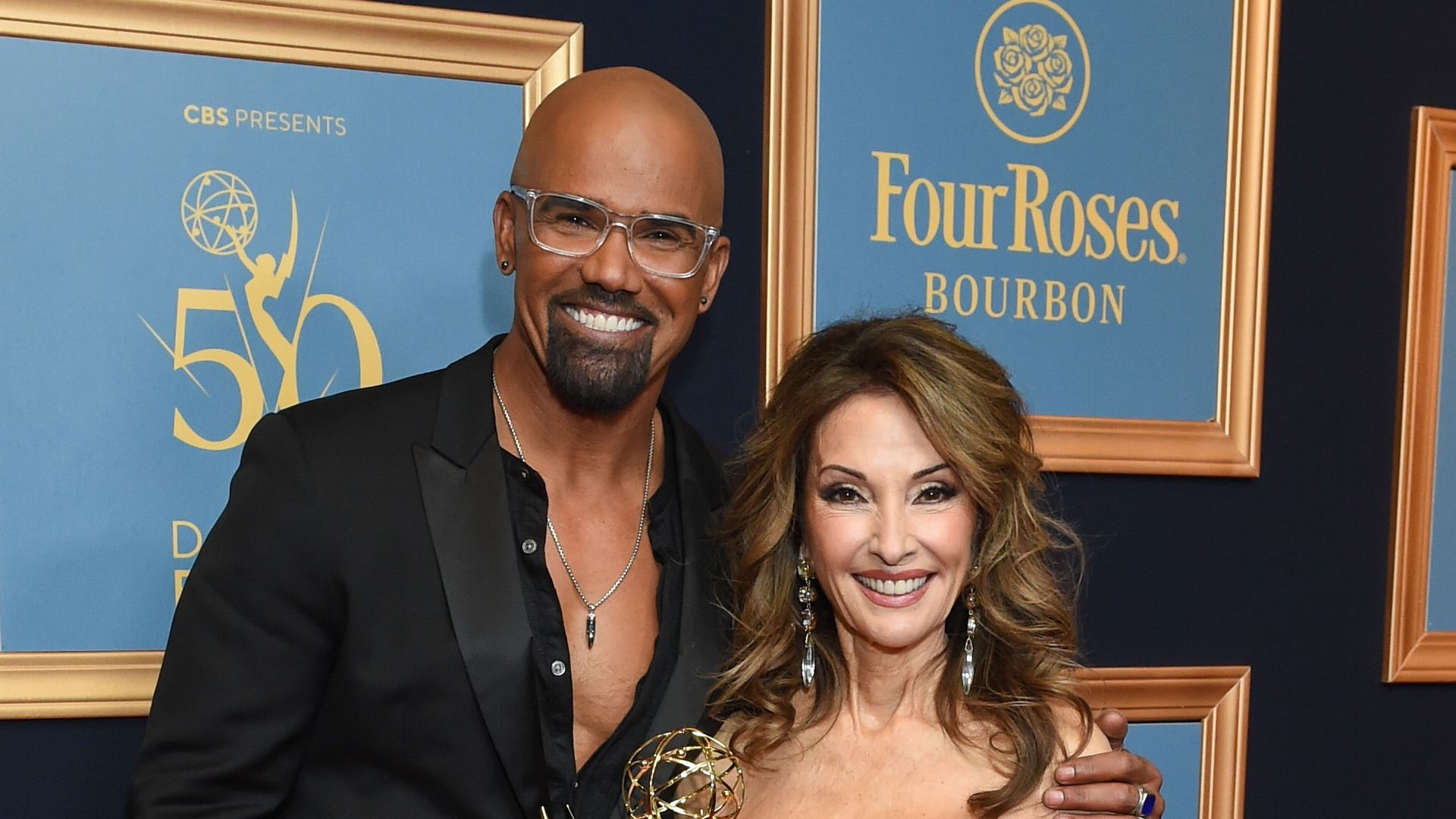Shemar Moore and Susan Lucci pose with the Emmy Award for Lifetime Achievement at the 50th Annual Daytime Emmy Awards 