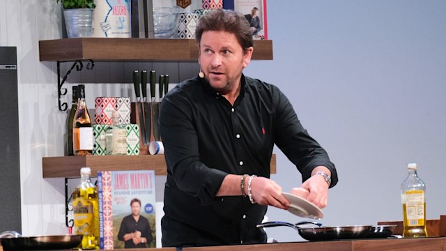 James Martin in a black shirt cooking food