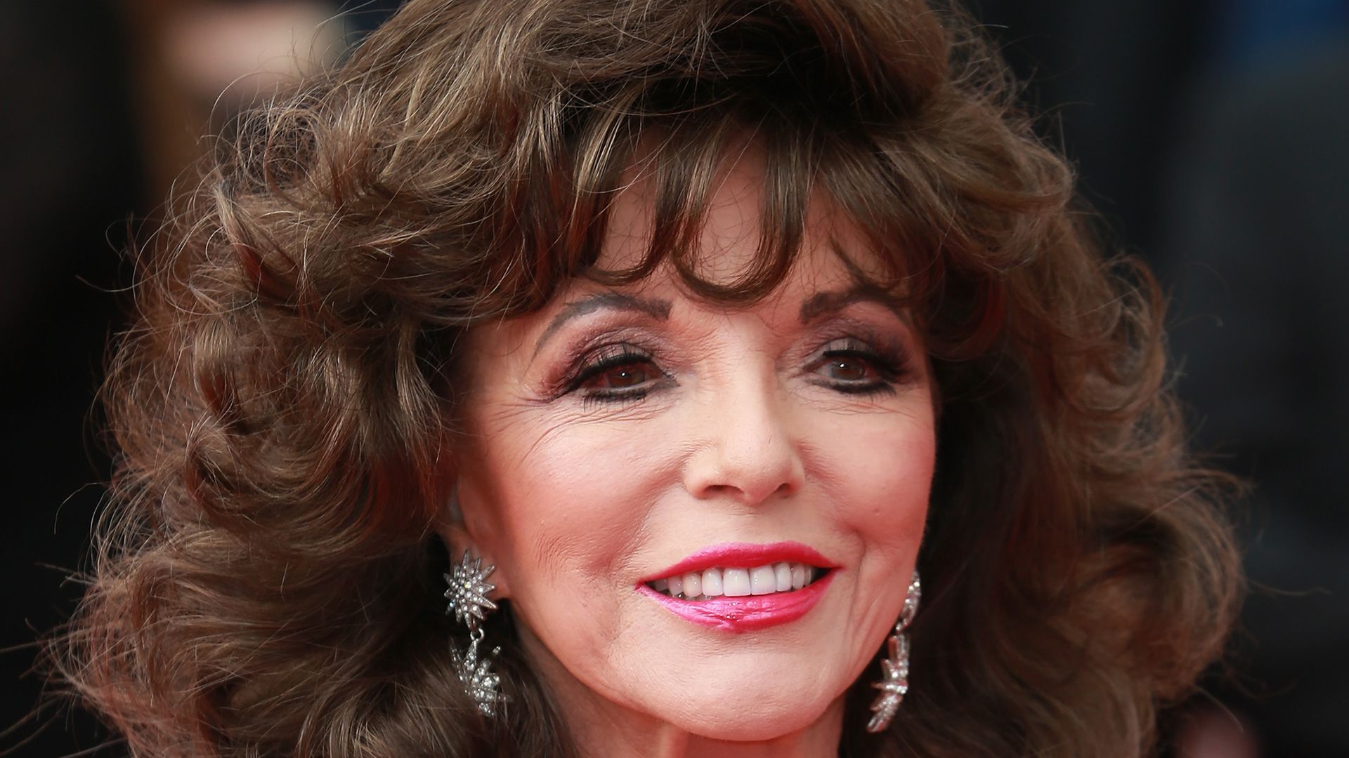 Joan Collins, 91, is a glittering goddess for celebration with husband Percy